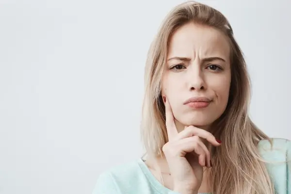a woman with weird expression because of frown lines