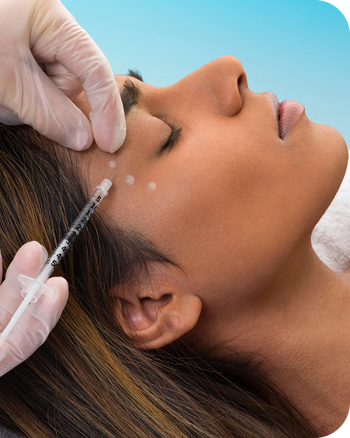 a woman closing eyes getting botox injection