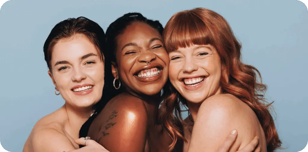 womens smiling and posing after jeuveau treatment in san diego