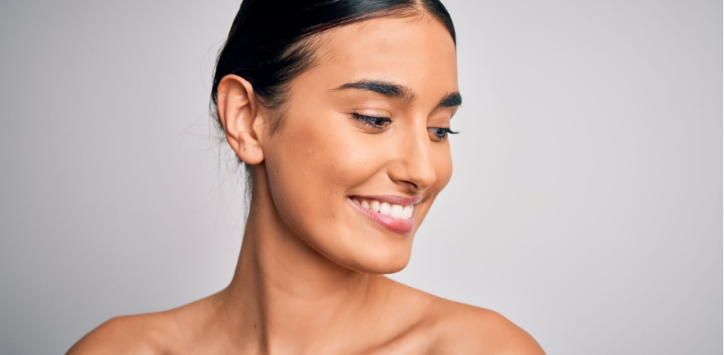 women smiling together with youthful, natural-looking facial expression
